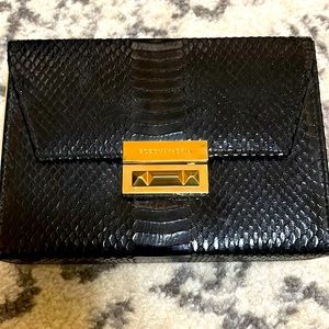 BCBG Black snakeskin clutch